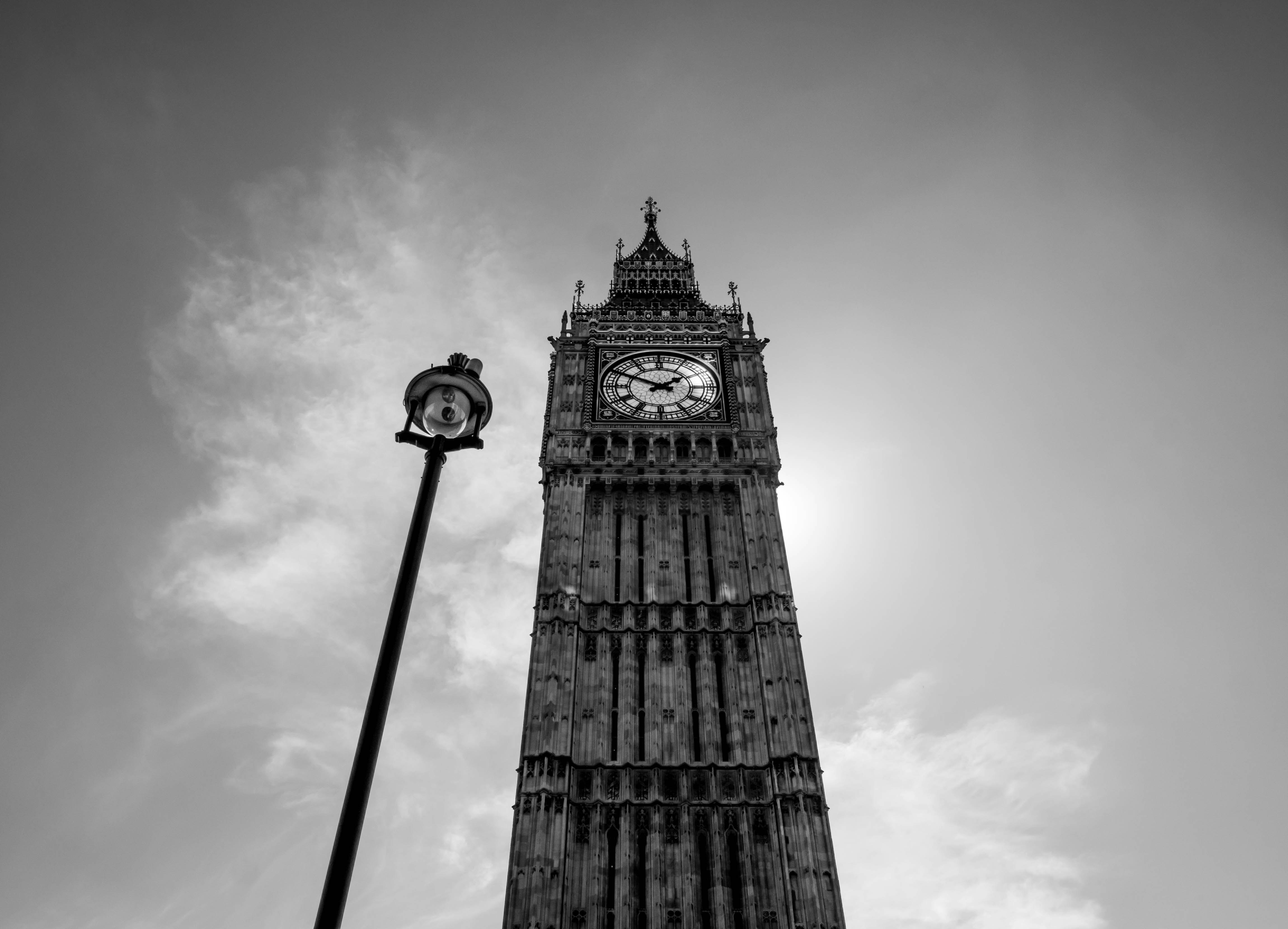 grayscale photo of clock tower